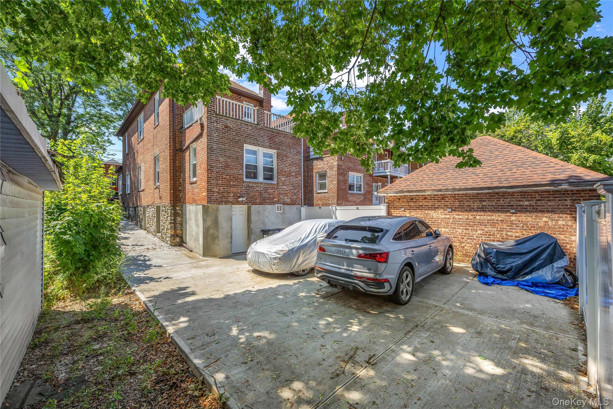 4114 Wickham Avenue Bronx, NY 10466 - Photo 22 of 27 a car parked in front of white house