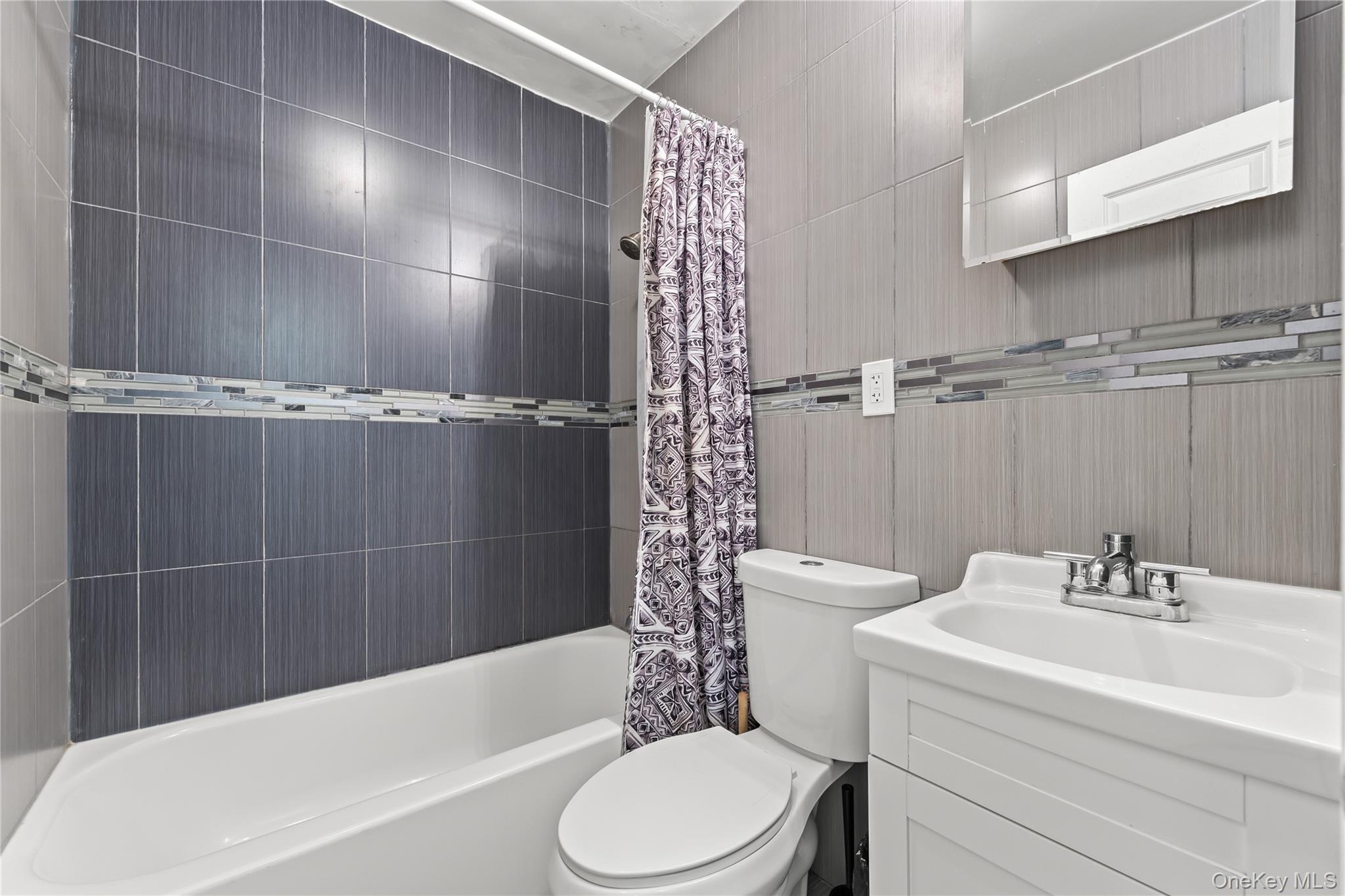 4114 Wickham Avenue Bronx, NY 10466 - Photo 8 of 27 a bathroom with a sink toilet and shower