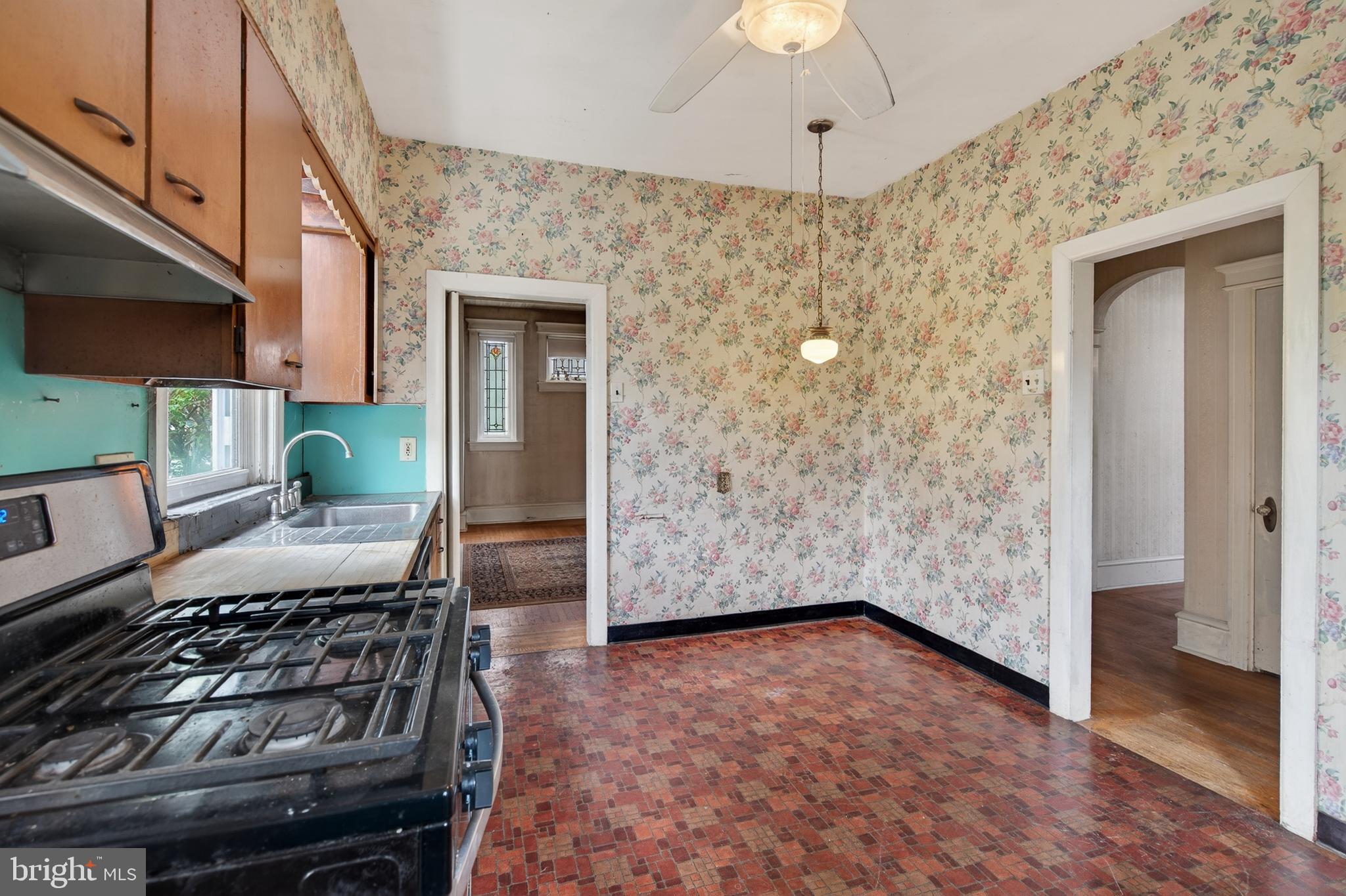 705 East 20th Street Chester, PA 19013 - Photo 13 of 41 a bedroom with a bed and a ceiling fan