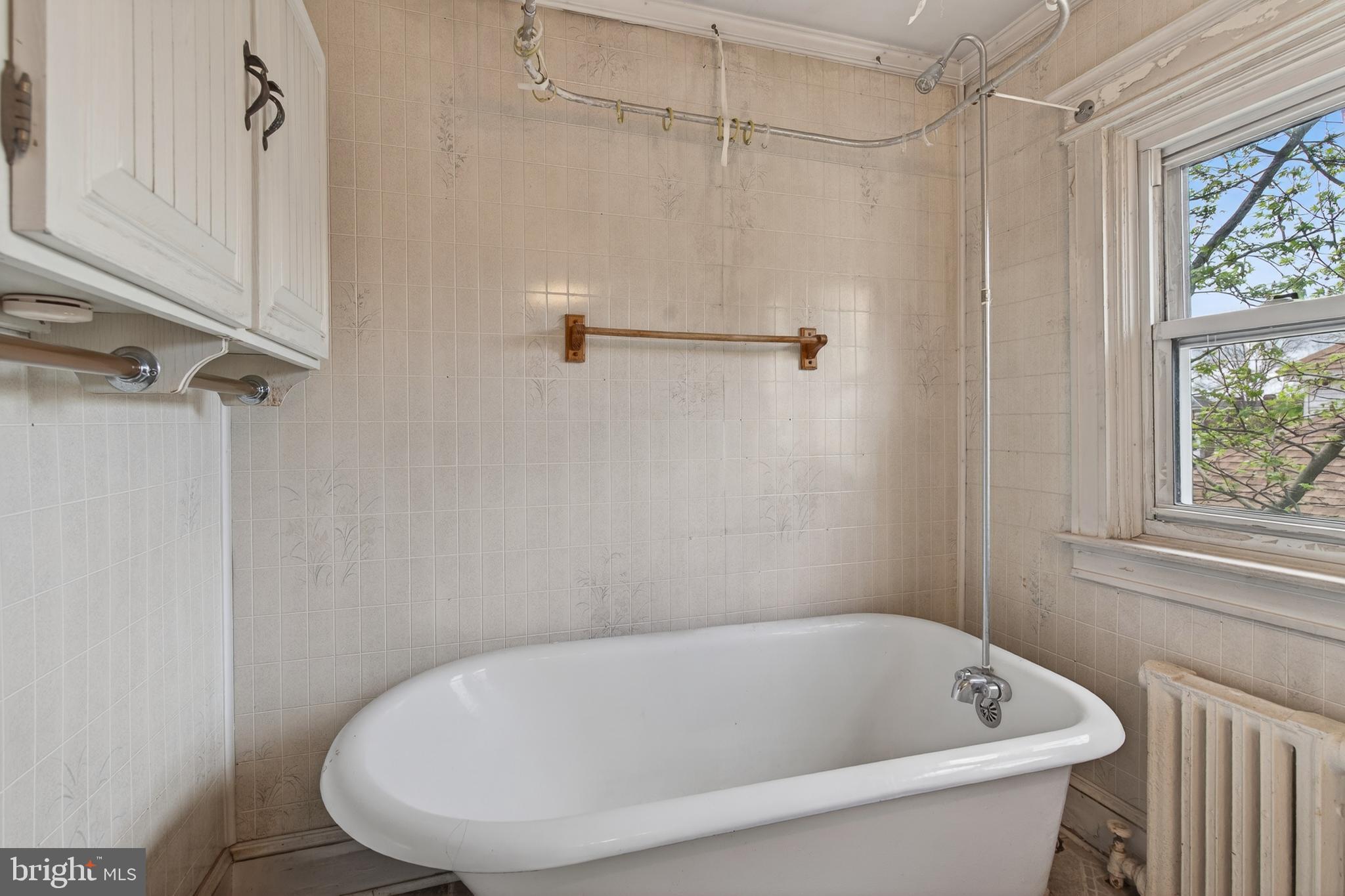 705 East 20th Street Chester, PA 19013 - Photo 18 of 41 a white bath tub sitting next to a shower
