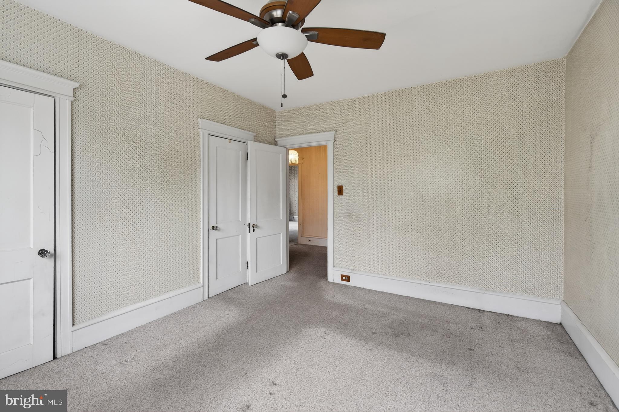 705 East 20th Street Chester, PA 19013 - Photo 20 of 41 an empty room with chandelier fan