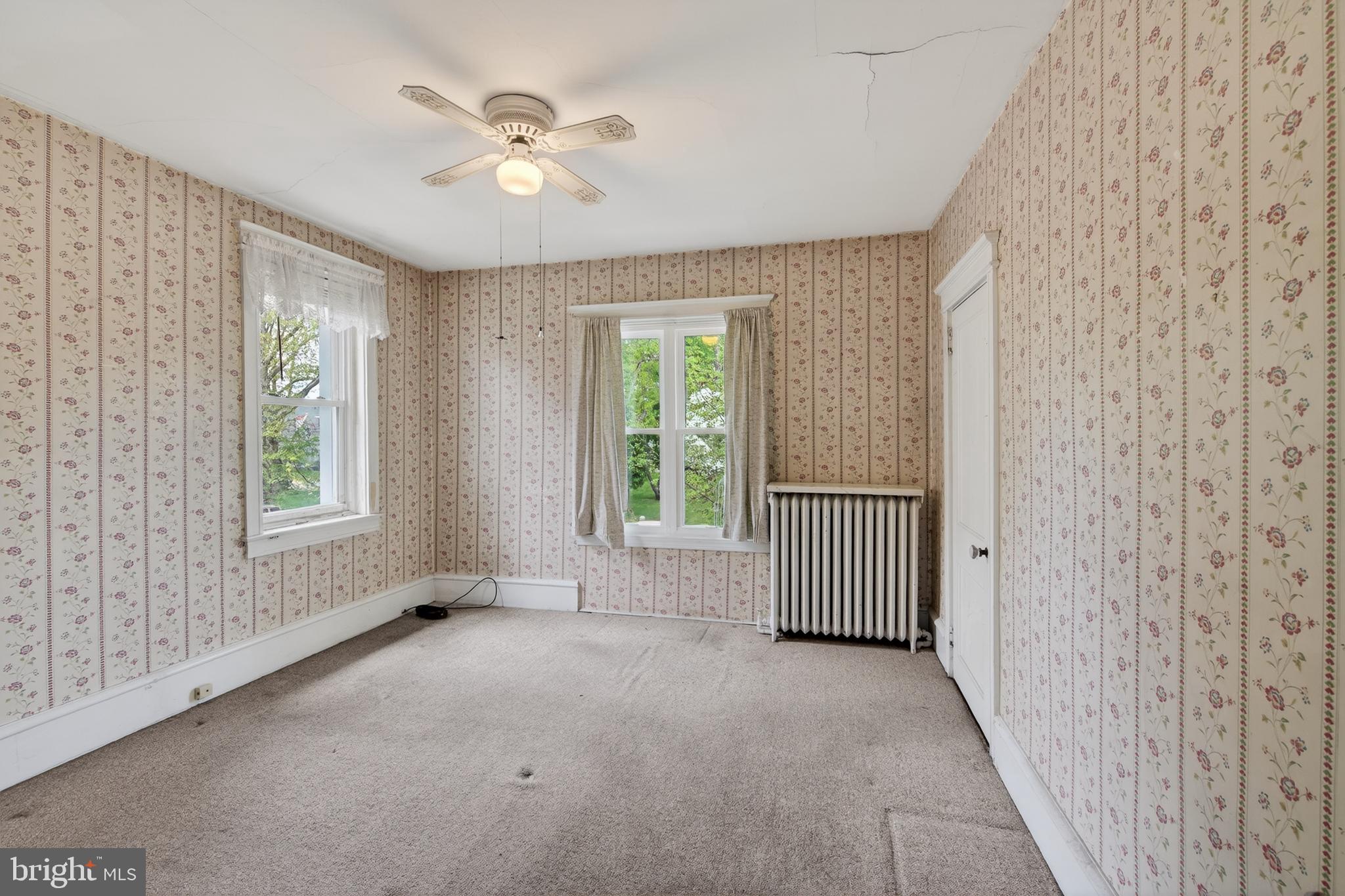 705 East 20th Street Chester, PA 19013 - Photo 24 of 41 an empty room with windows and fan