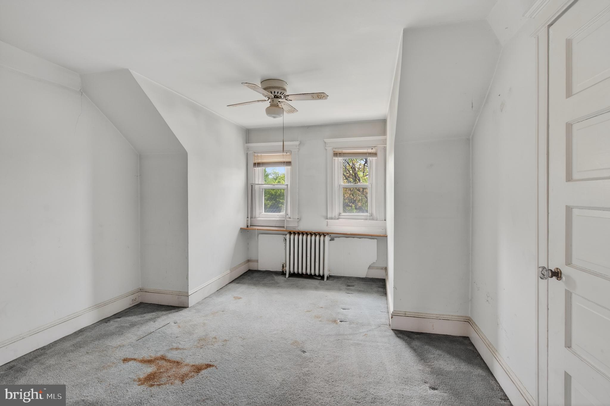 705 East 20th Street Chester, PA 19013 - Photo 28 of 41 a view of room with a ceiling fan and window