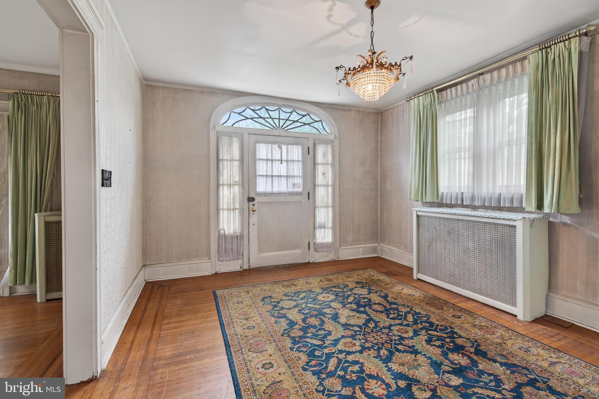 705 East 20th Street Chester, PA 19013 - Photo 4 of 41 a view of a room with window and wooden floor