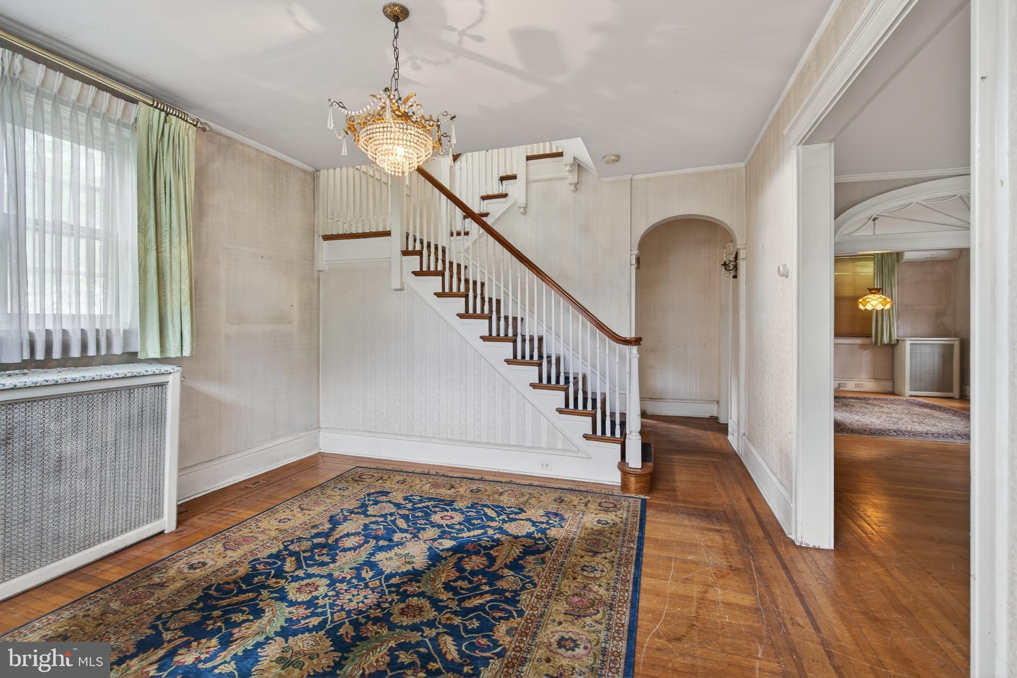 705 East 20th Street Chester, PA 19013 - Photo 5 of 41 a view of entryway and hall with wooden floor