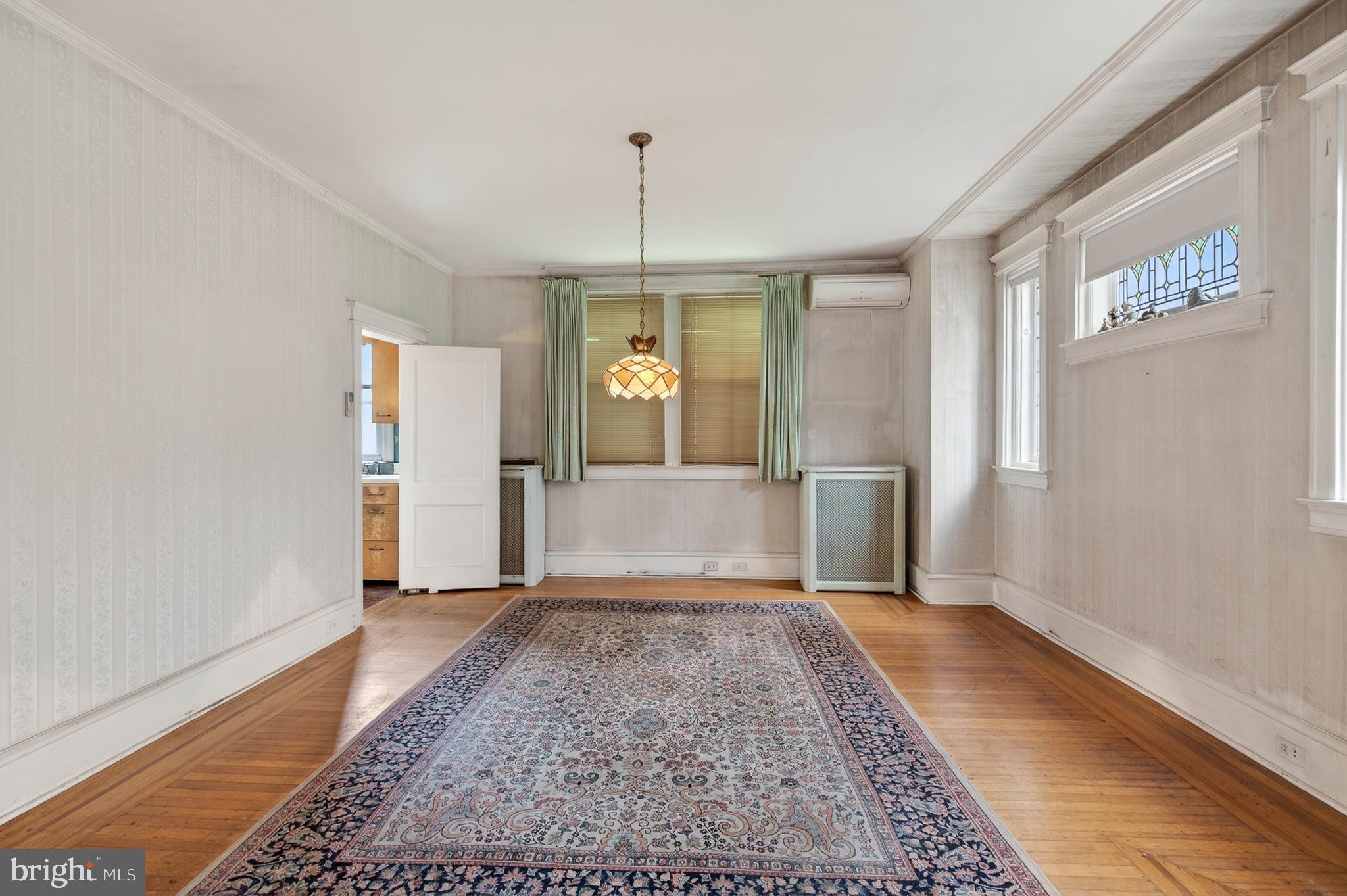 705 East 20th Street Chester, PA 19013 - Photo 9 of 41 a view of a hallway with wooden floor and a living room