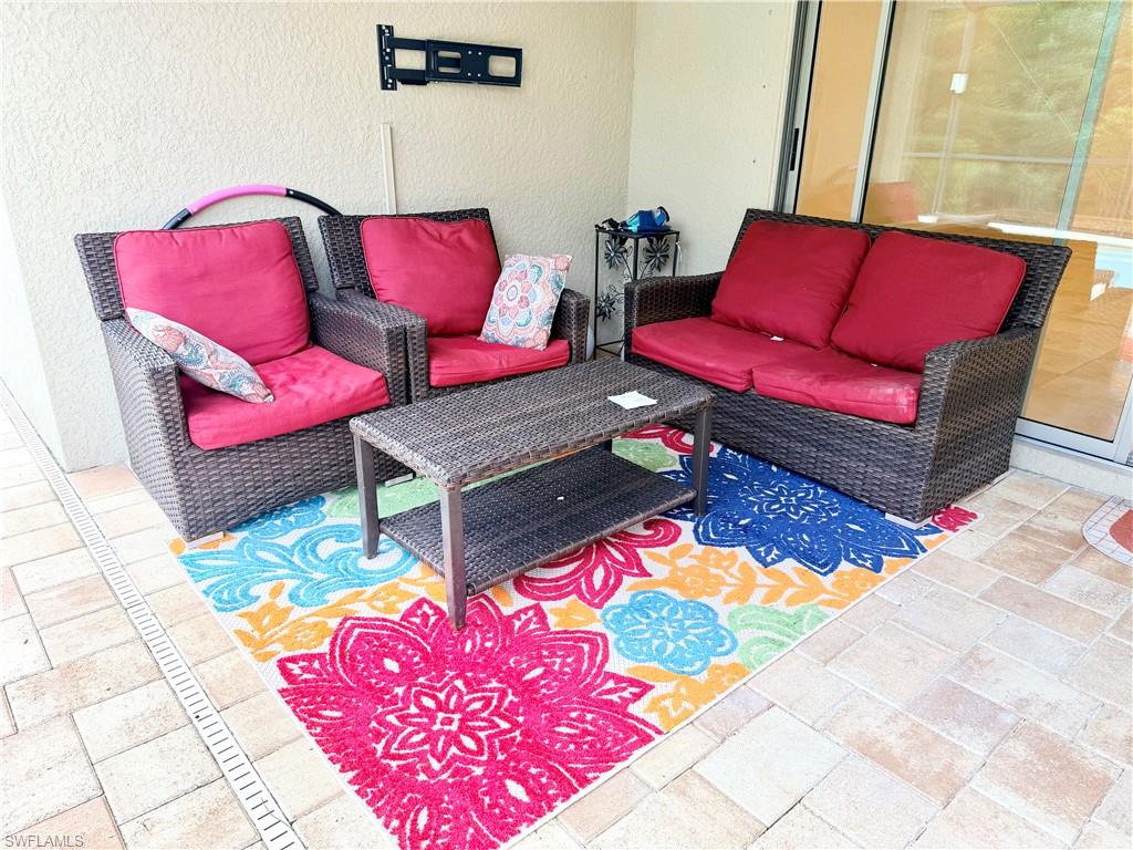 16432 Aberdeen Way Naples, FL 34110 - Photo 19 of 21 a living room with furniture and a couch