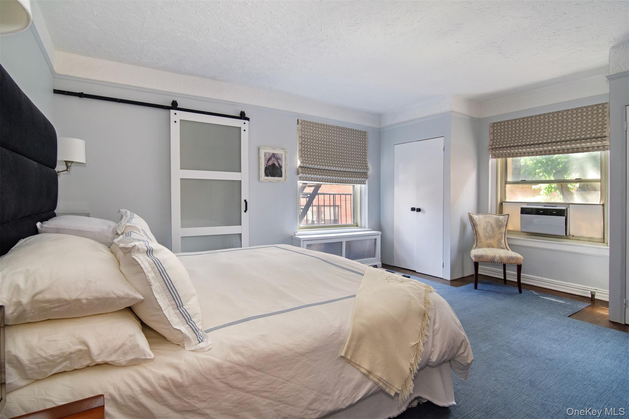 250 Bronxville Road, Unit 3I Bronxville, NY 10708 - Photo 9 of 17 a bedroom with a bed and a couch