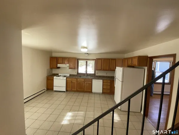 a view of kitchen with furniture and window