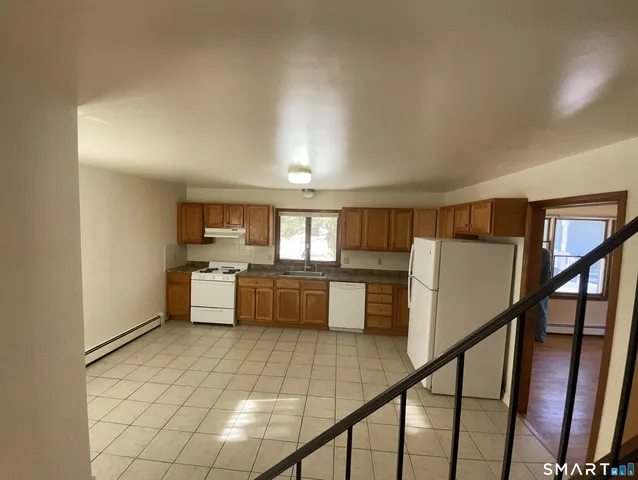 a view of kitchen with furniture and window