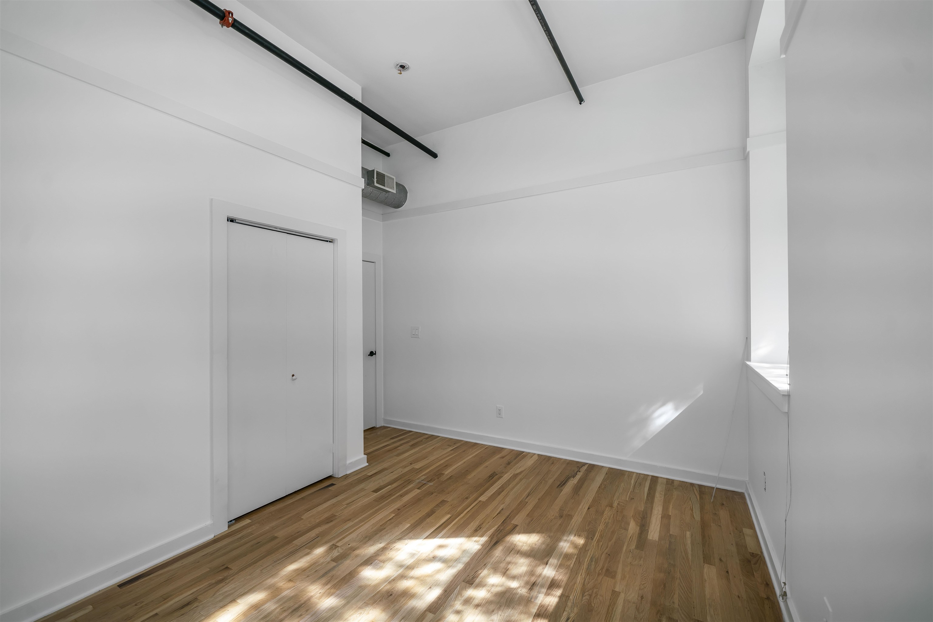 1015 Clinton Street, Unit 204 Hoboken, NJ 07030 - Photo 14 of 22 a view of small space with racks on the wall