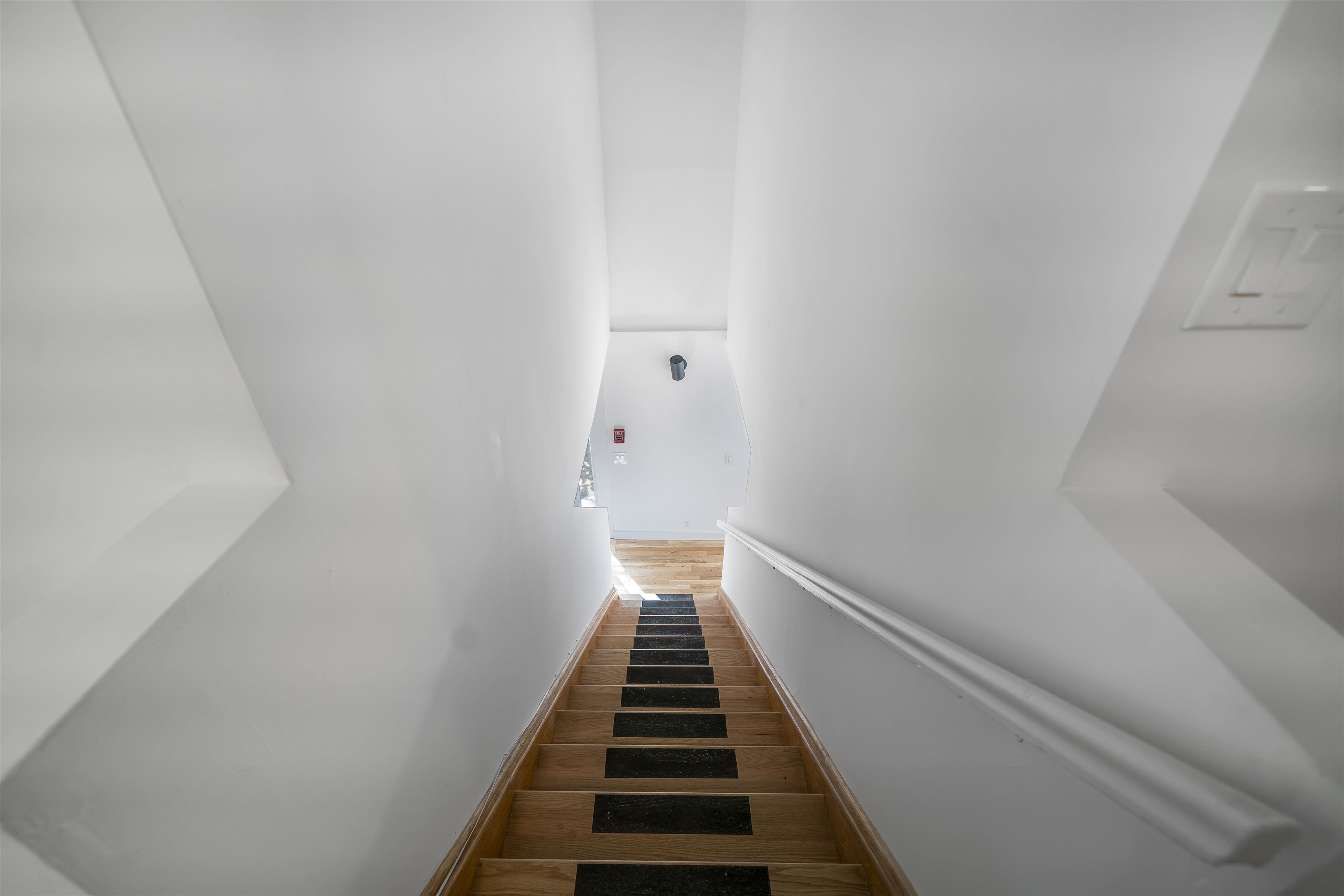 1015 Clinton Street, Unit 204 Hoboken, NJ 07030 - Photo 15 of 22 a view of a hallway with stairs