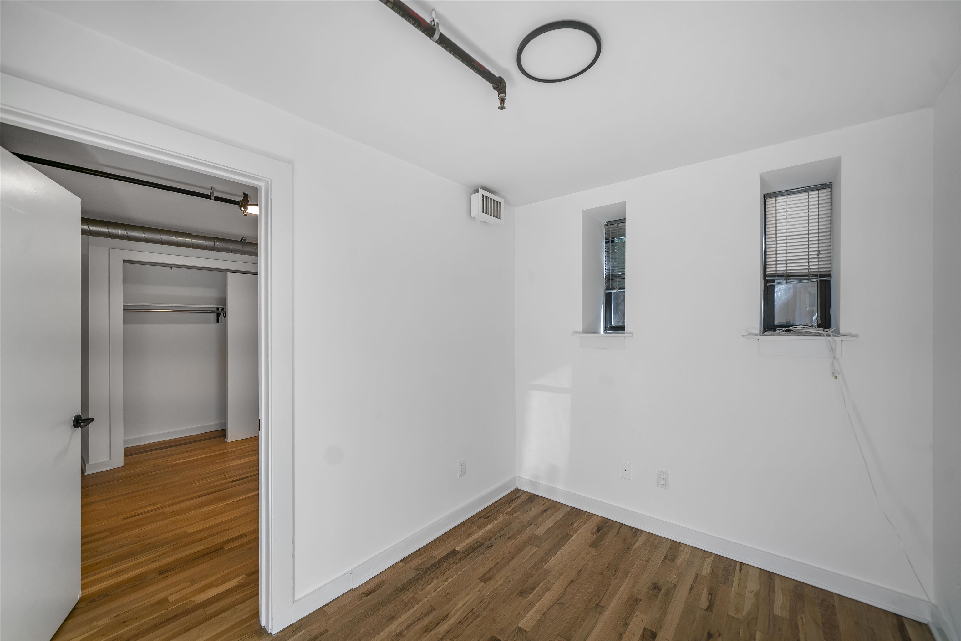 1015 Clinton Street, Unit 204 Hoboken, NJ 07030 - Photo 19 of 22 a view of a room with wooden floor and bathroom