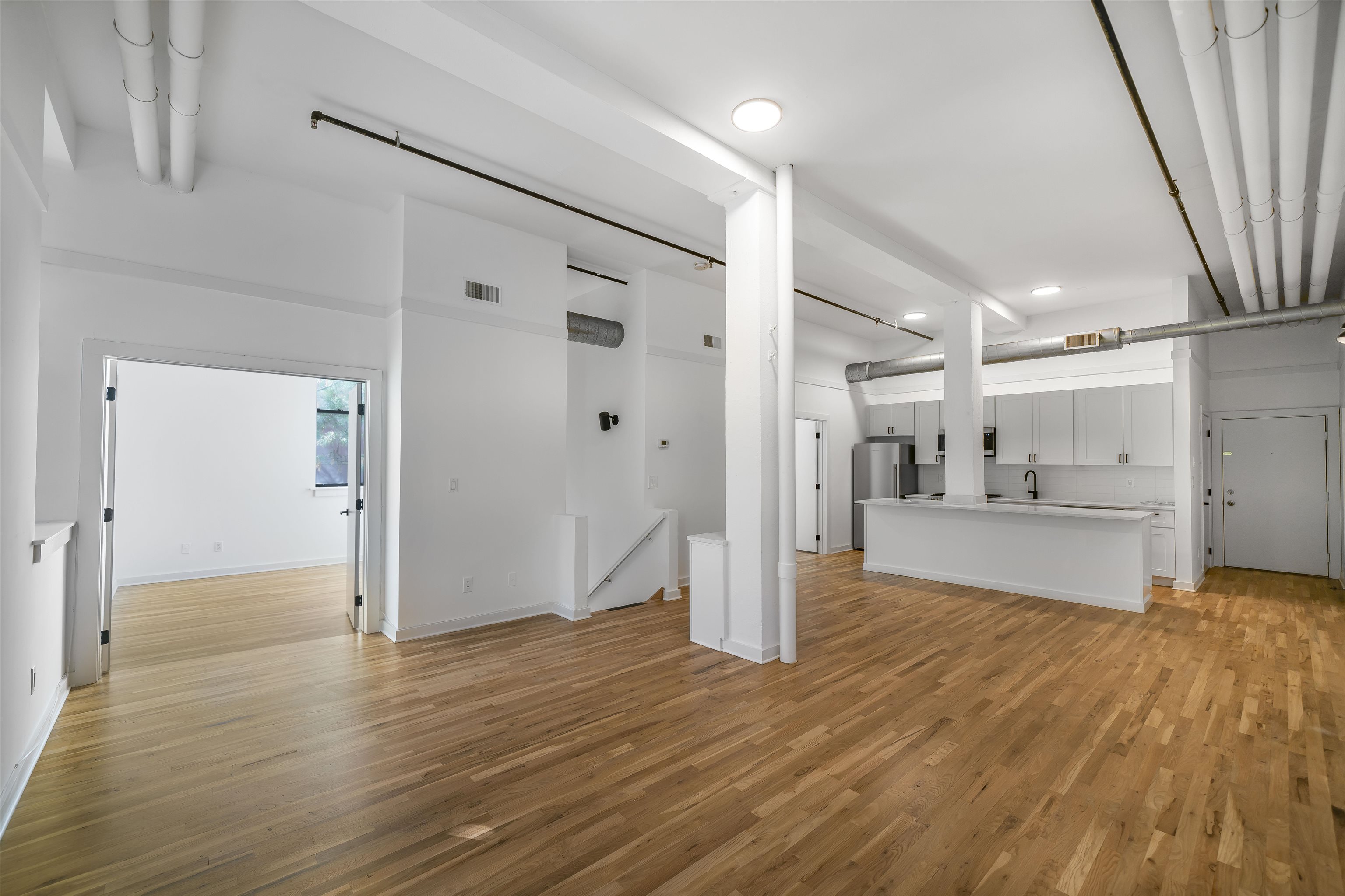 1015 Clinton Street, Unit 204 Hoboken, NJ 07030 - Photo 2 of 22 a view of a hallway and wooden floor