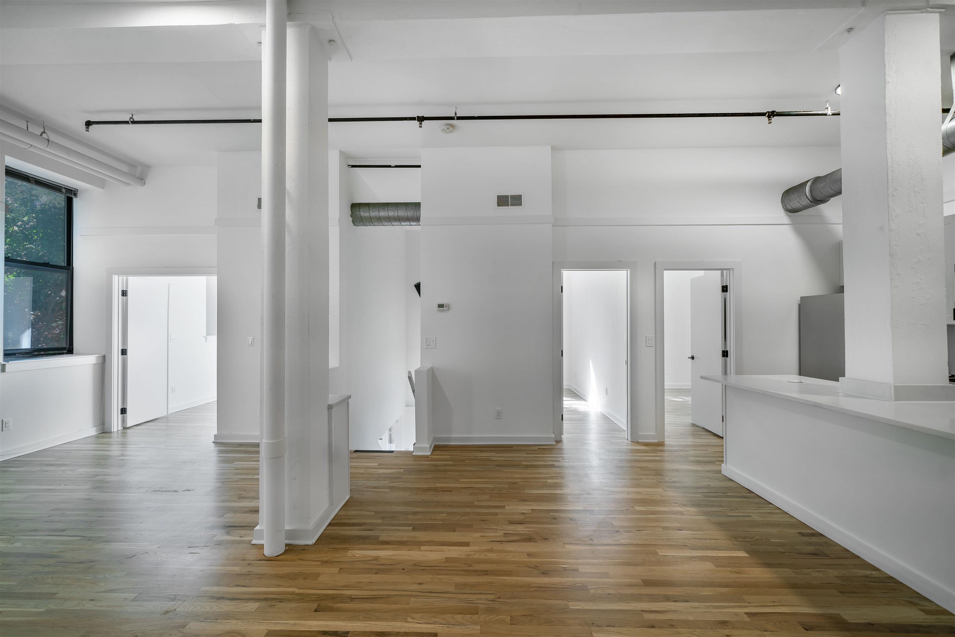 1015 Clinton Street, Unit 204 Hoboken, NJ 07030 - Photo 4 of 22 a view of empty room with wooden floor