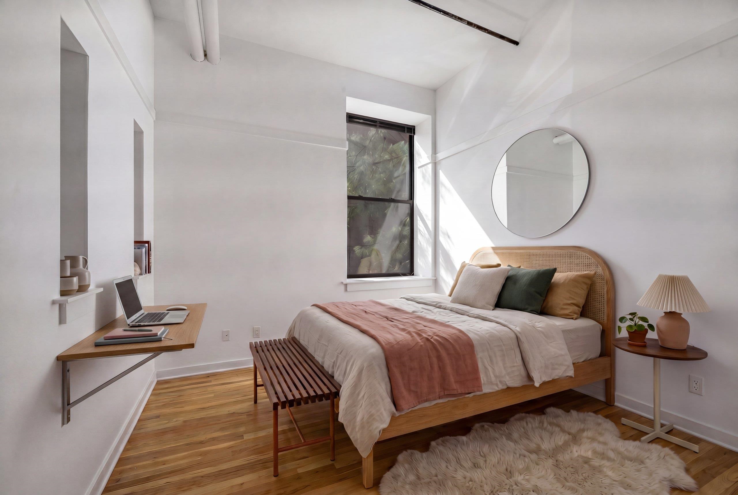 1015 Clinton Street, Unit 204 Hoboken, NJ 07030 - Photo 8 of 22 a bedroom with a bed and wooden floor