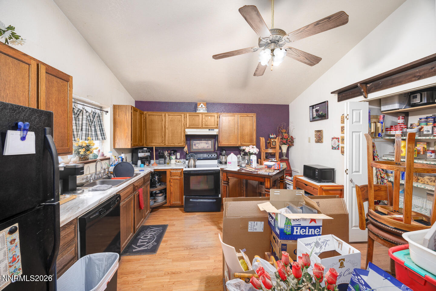 2000 Trails End Fallon, NV 89406 - Photo 5 of 20 a large white kitchen with stainless steel appliances granite countertop a stove and a dining table
