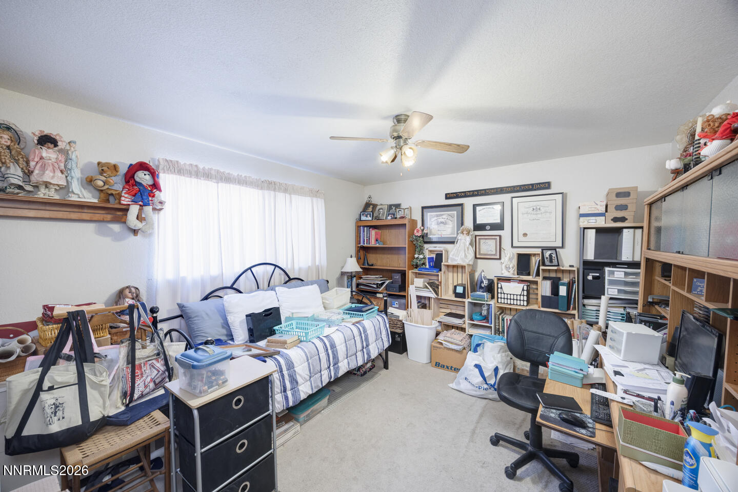 2000 Trails End Fallon, NV 89406 - Photo 9 of 20 a living room with furniture or couch and a bookshelf