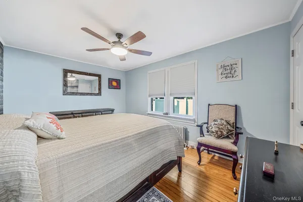 a bedroom with a bed and dresser