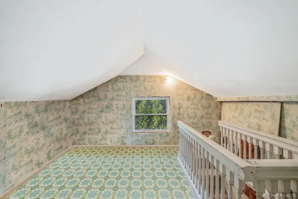 a view of a hallway with windows