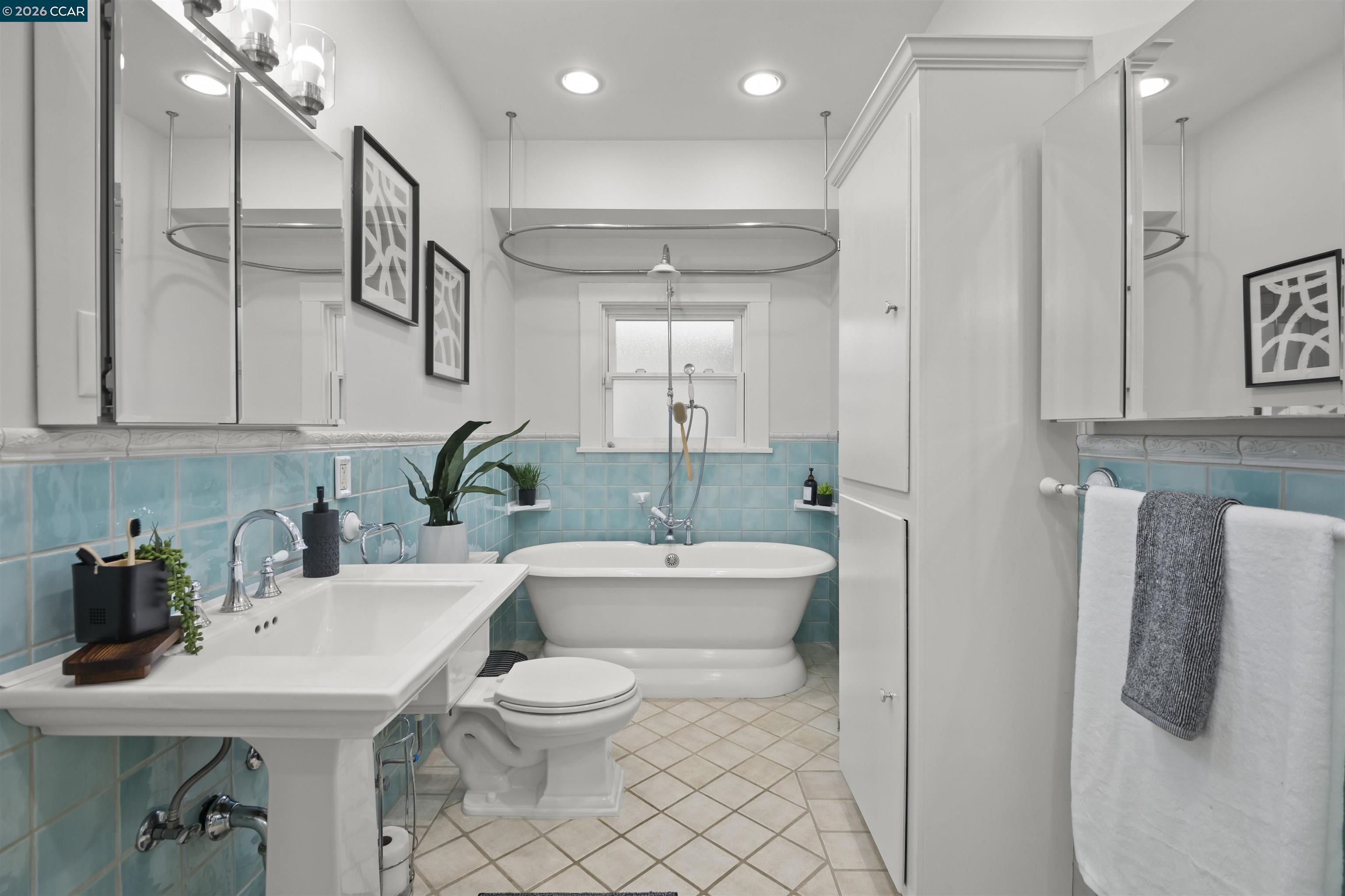 5428 Ruth Avenue Oakland, CA 94601 - Photo 15 of 17 a bathroom with a toilet a sink and mirror