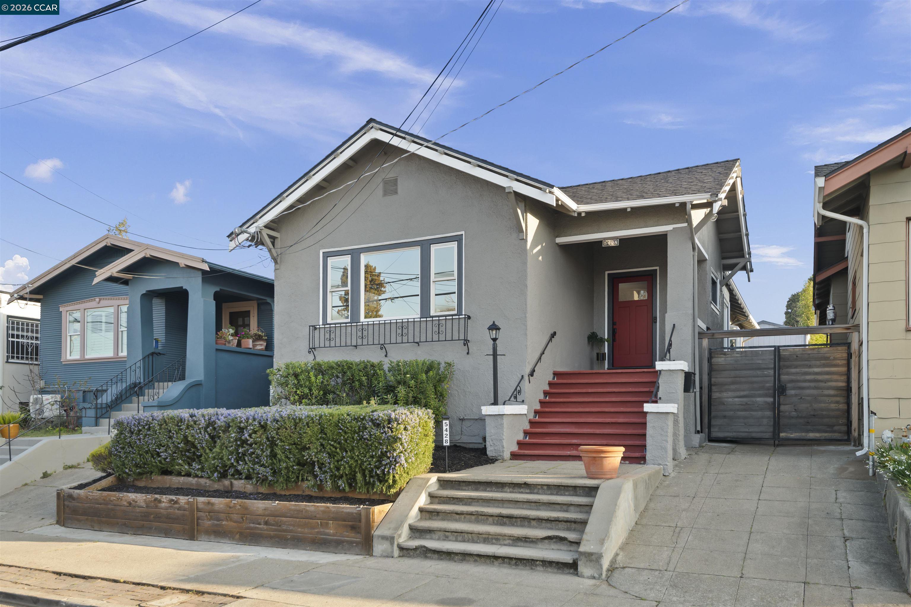 5428 Ruth Avenue Oakland, CA 94601 - Photo 2 of 17 a front view of a house with a yard