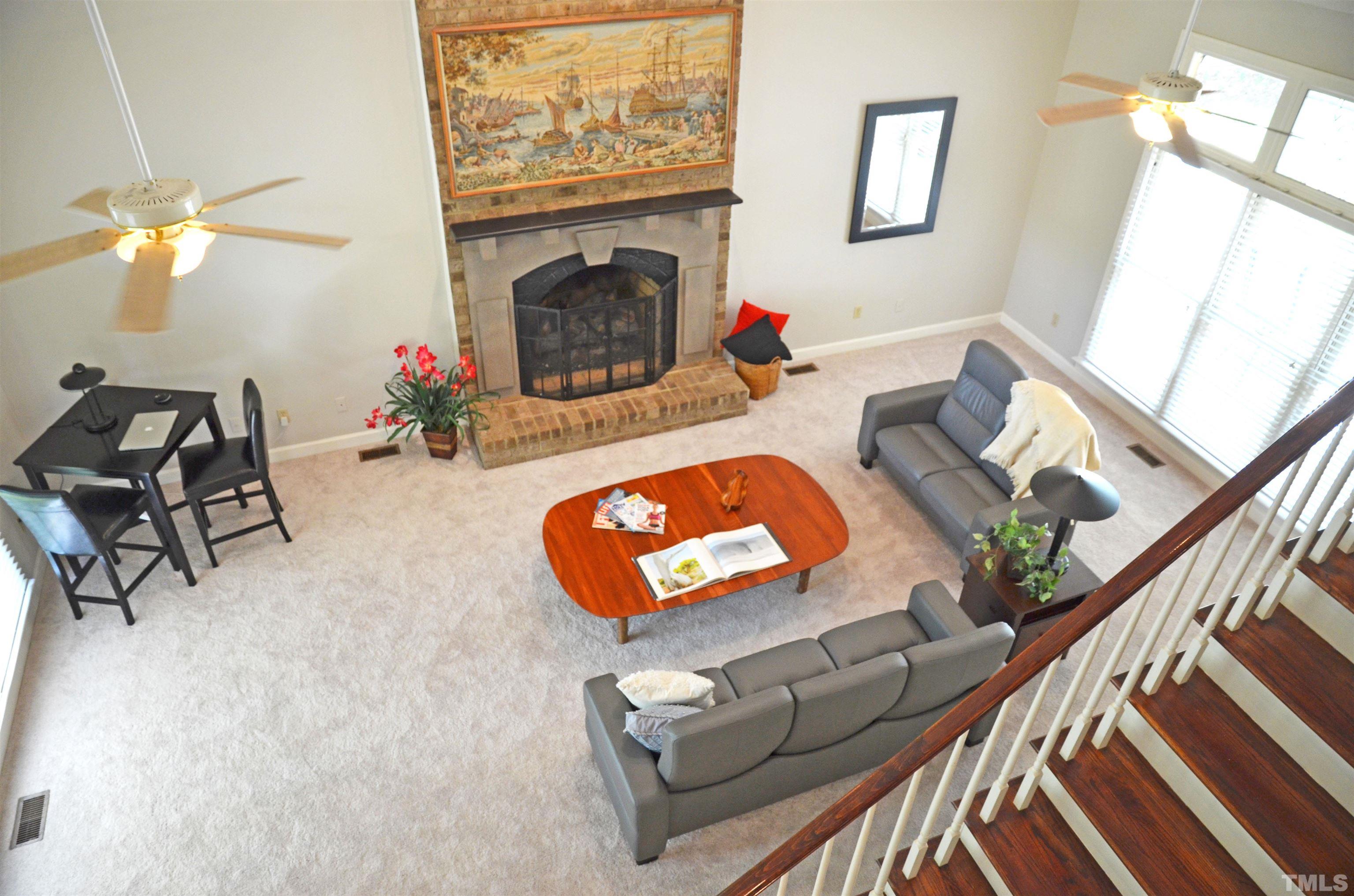 4907 Old Elizabeth Road Raleigh, NC 27616 - Photo 16 of 30 a living room with furniture and a fireplace