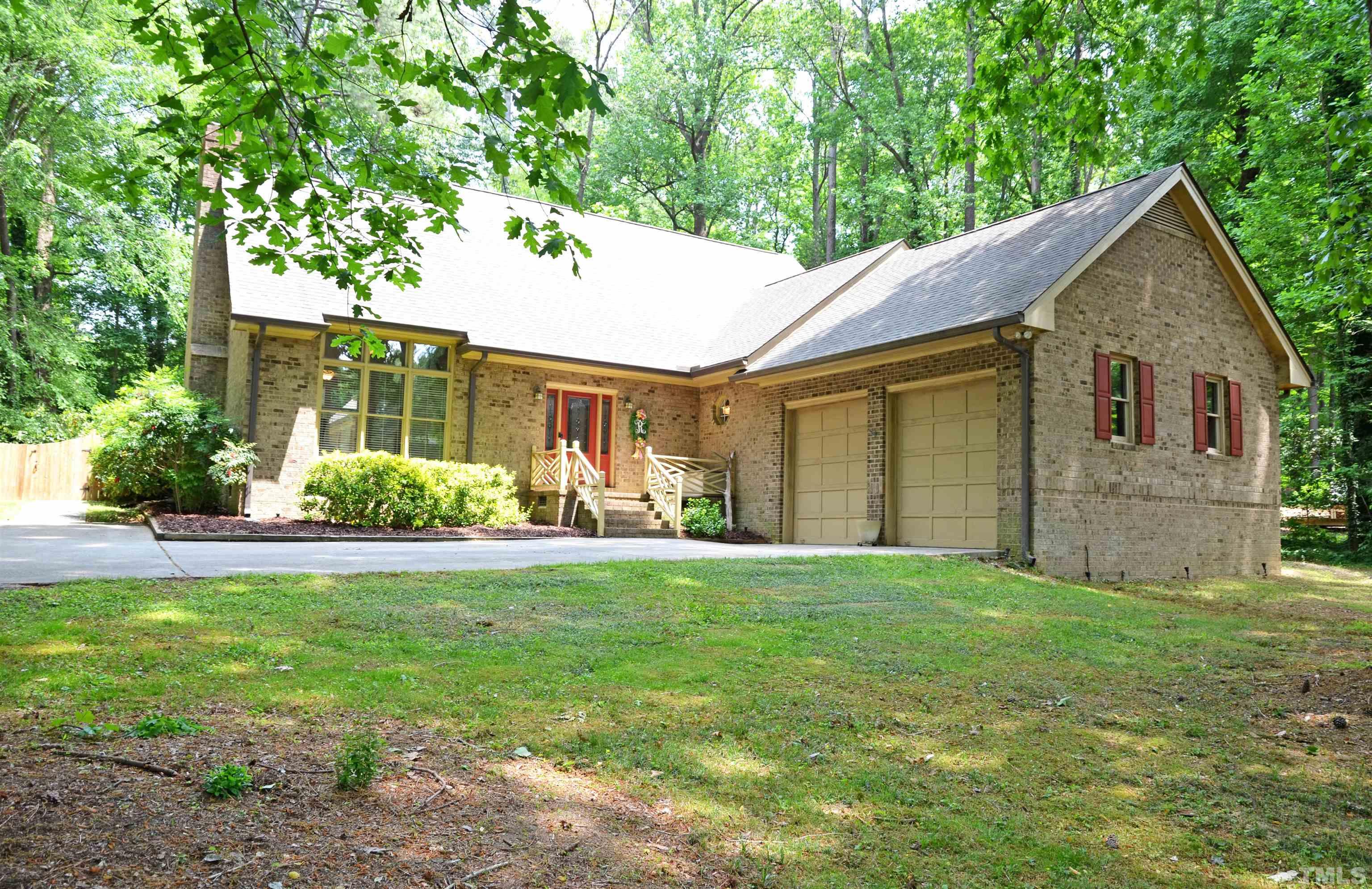 4907 Old Elizabeth Road Raleigh, NC 27616 - Photo 19 of 30 a front view of a house with a yard and garage