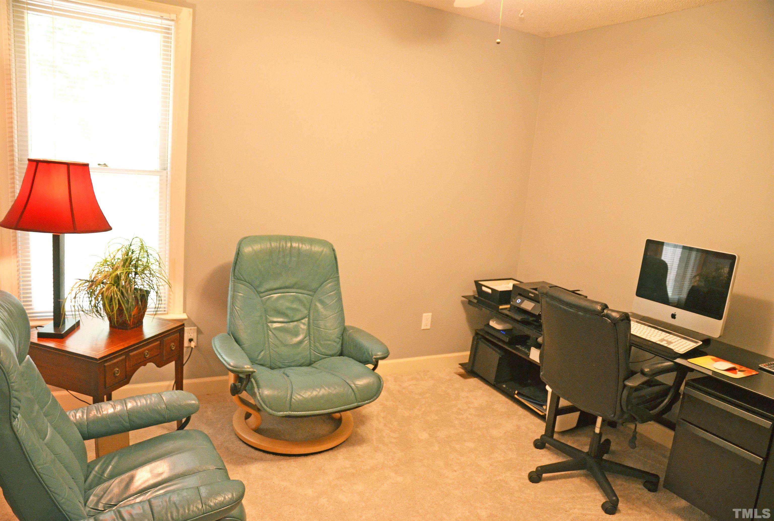 4907 Old Elizabeth Road Raleigh, NC 27616 - Photo 2 of 30 a view of a workspace with furniture