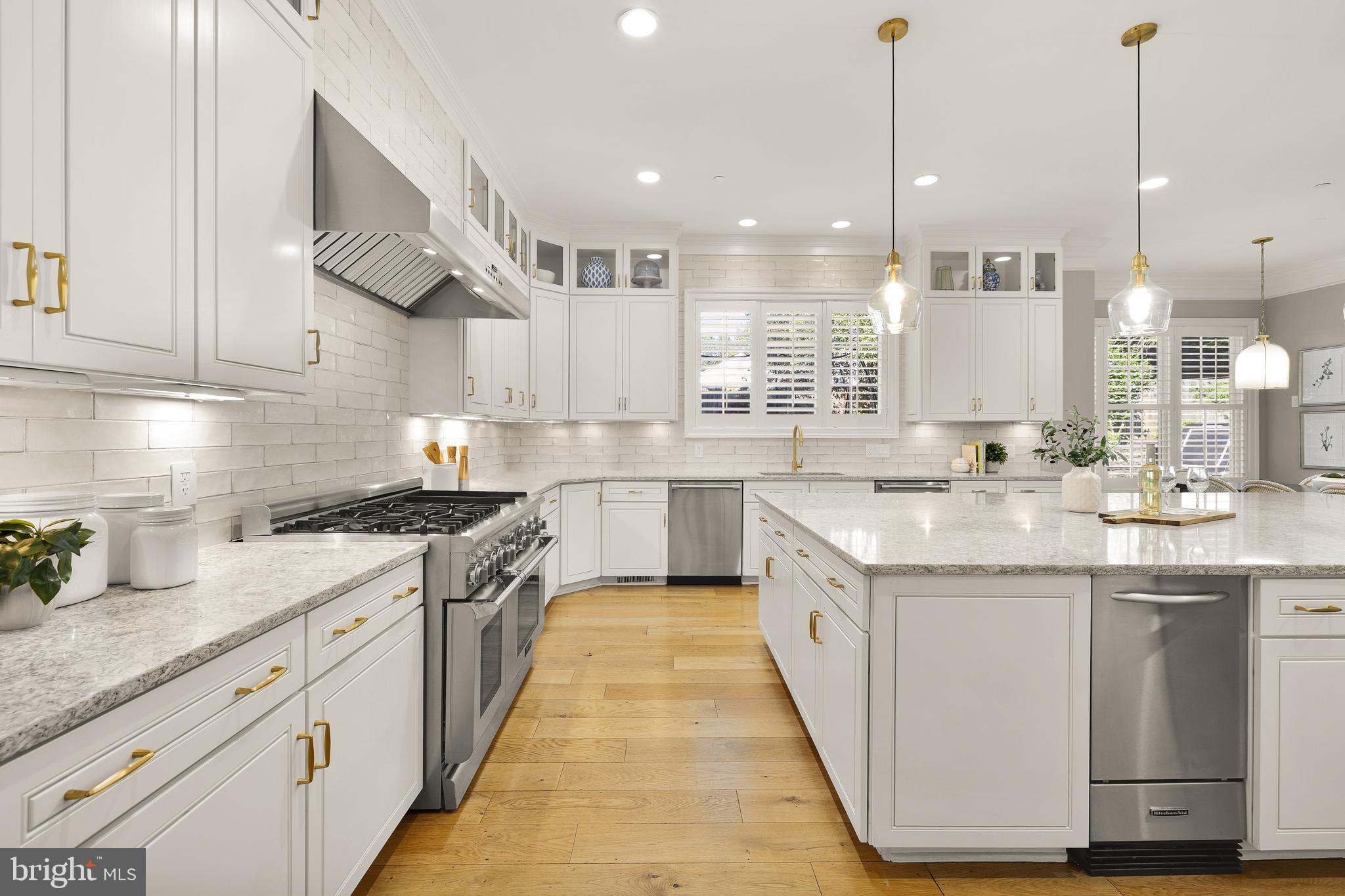 5606 Parkston Road Bethesda, MD 20816 - Photo 18 of 50 a kitchen with stainless steel appliances granite countertop a sink a stove and a wooden floors