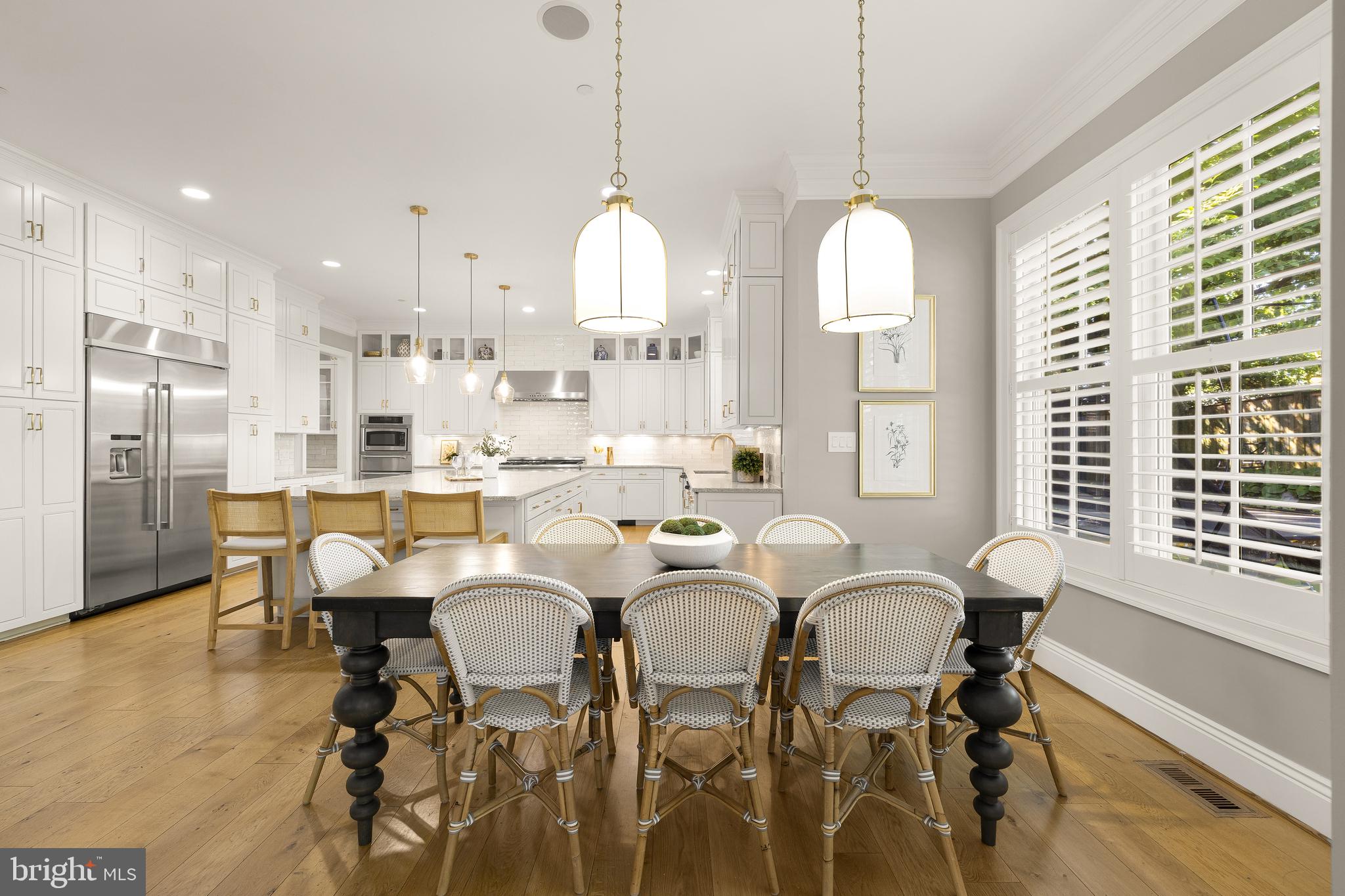 5606 Parkston Road Bethesda, MD 20816 - Photo 20 of 50 a dining room with furniture a window and stainless steel appliances