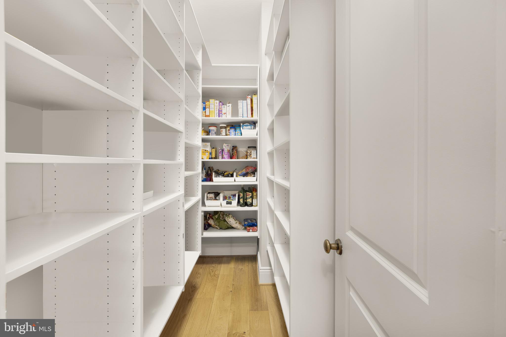 5606 Parkston Road Bethesda, MD 20816 - Photo 21 of 50 a view of a hallway with wooden floor and staircase
