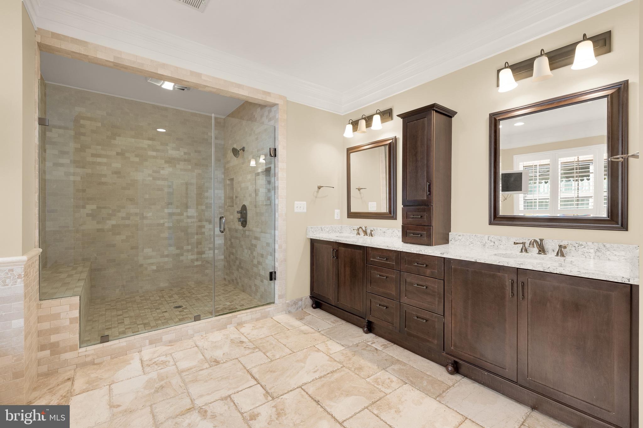 5606 Parkston Road Bethesda, MD 20816 - Photo 31 of 50 a bathroom with a double vanity sink mirror and shower