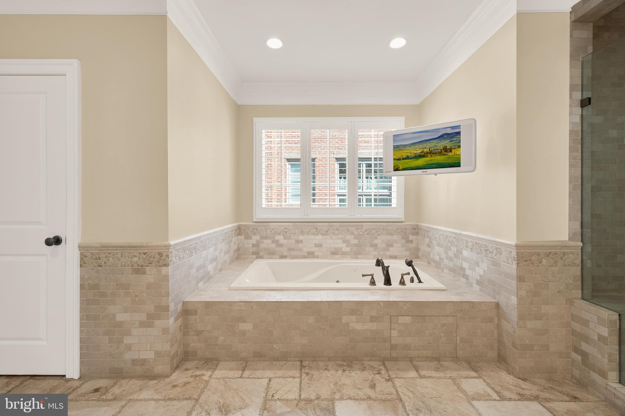 5606 Parkston Road Bethesda, MD 20816 - Photo 32 of 50 a spacious bathroom with bathtub and window