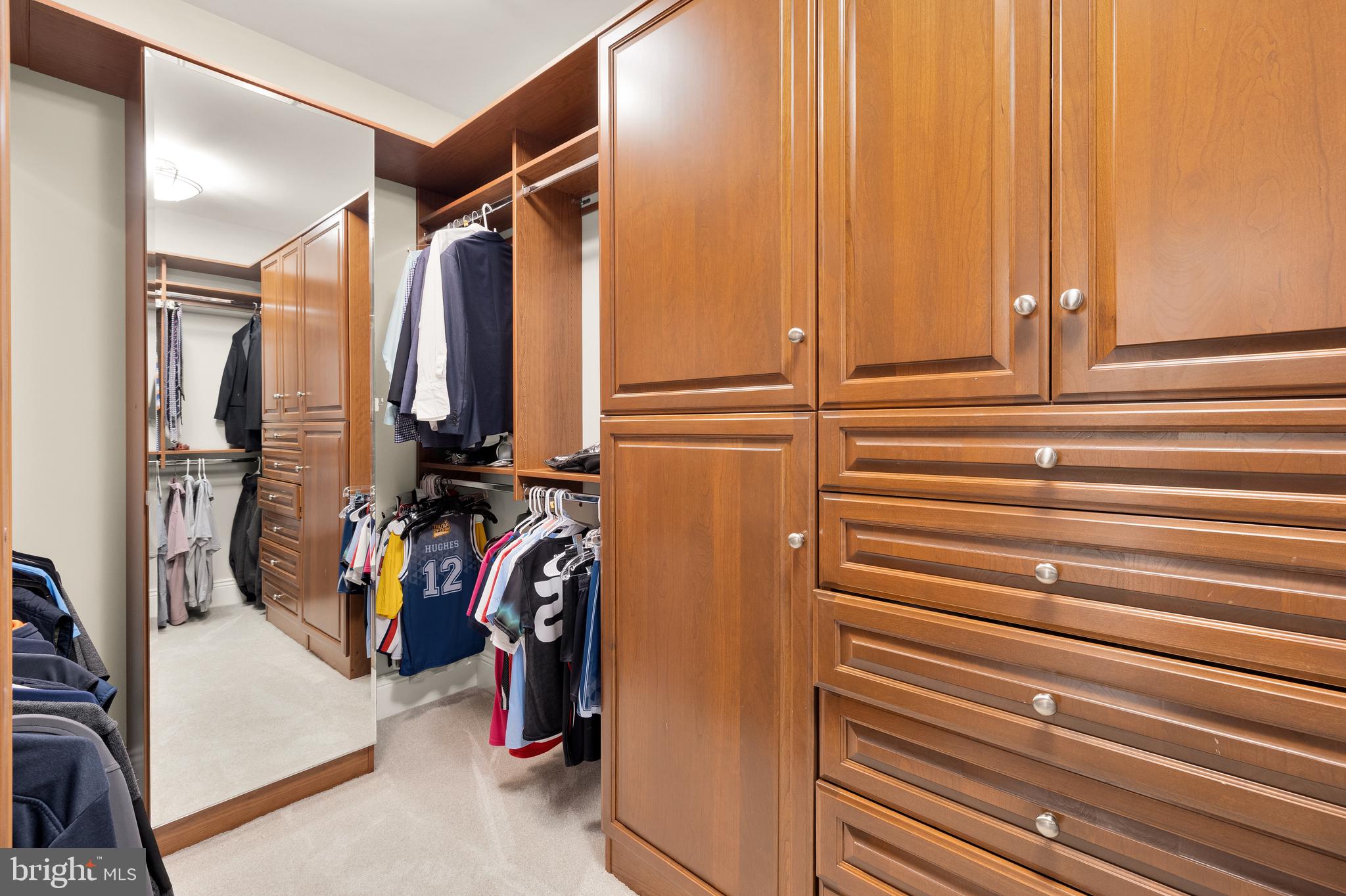 5606 Parkston Road Bethesda, MD 20816 - Photo 34 of 50 a view of walk in closet with clothes
