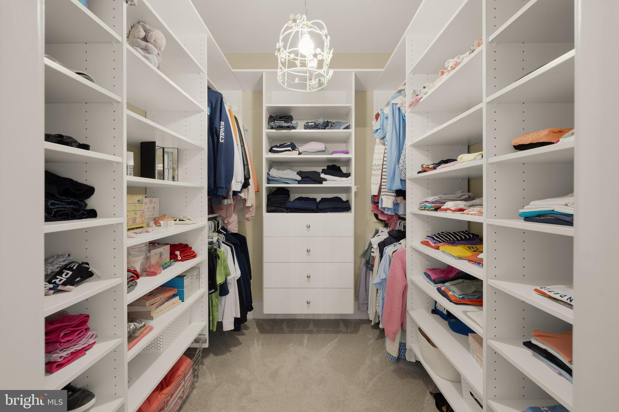 5606 Parkston Road Bethesda, MD 20816 - Photo 36 of 50 a view of walk in closet with clothes and shoes