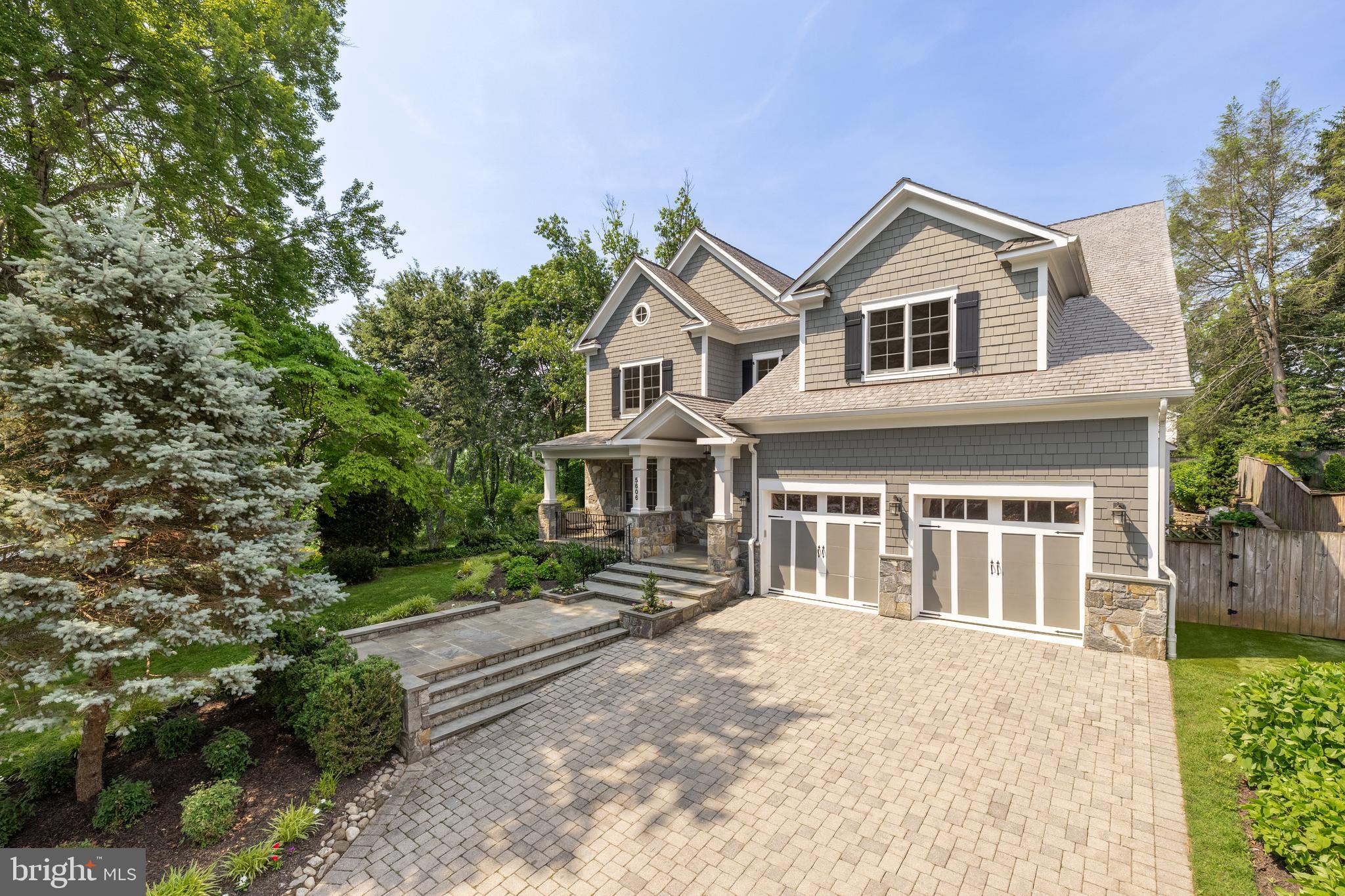 5606 Parkston Road Bethesda, MD 20816 - Photo 4 of 50 a front view of a house with a yard