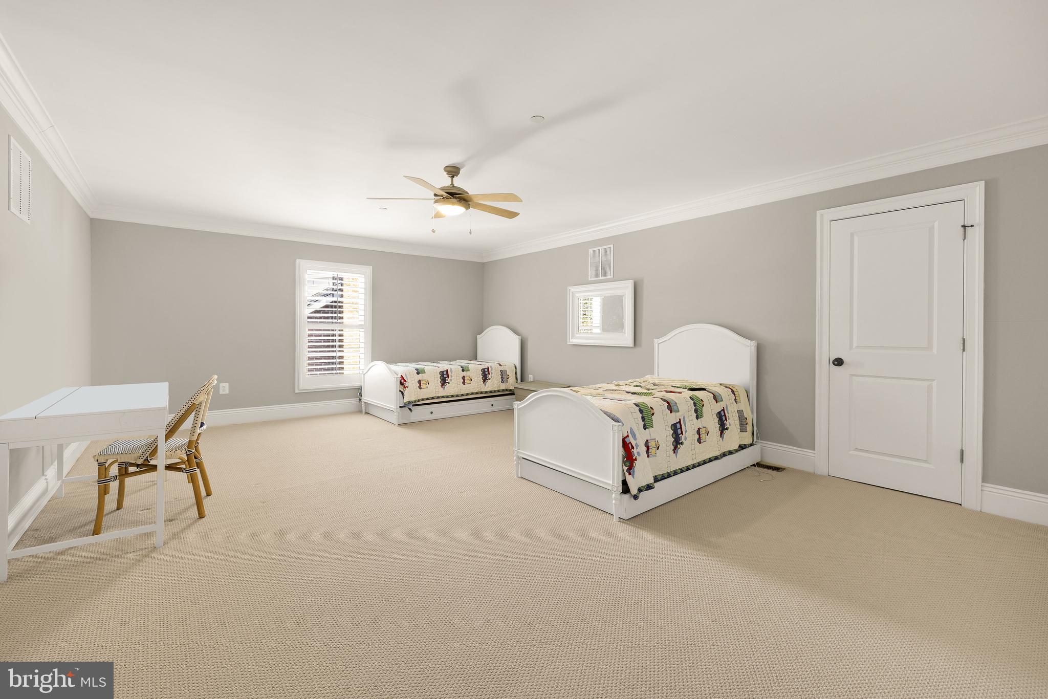 5606 Parkston Road Bethesda, MD 20816 - Photo 40 of 50 a spacious bedroom with a bed and chair