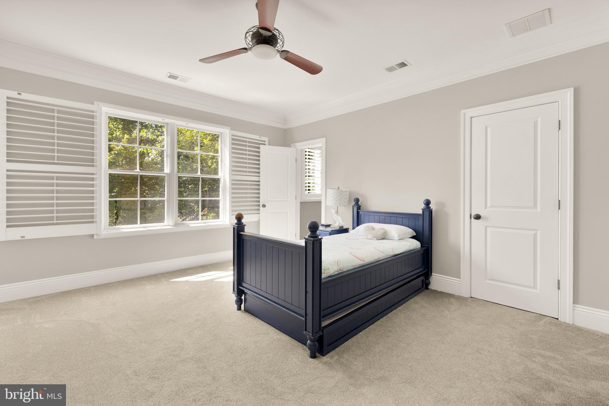 5606 Parkston Road Bethesda, MD 20816 - Photo 41 of 50 a bed sitting in a spacious bedroom next to a window