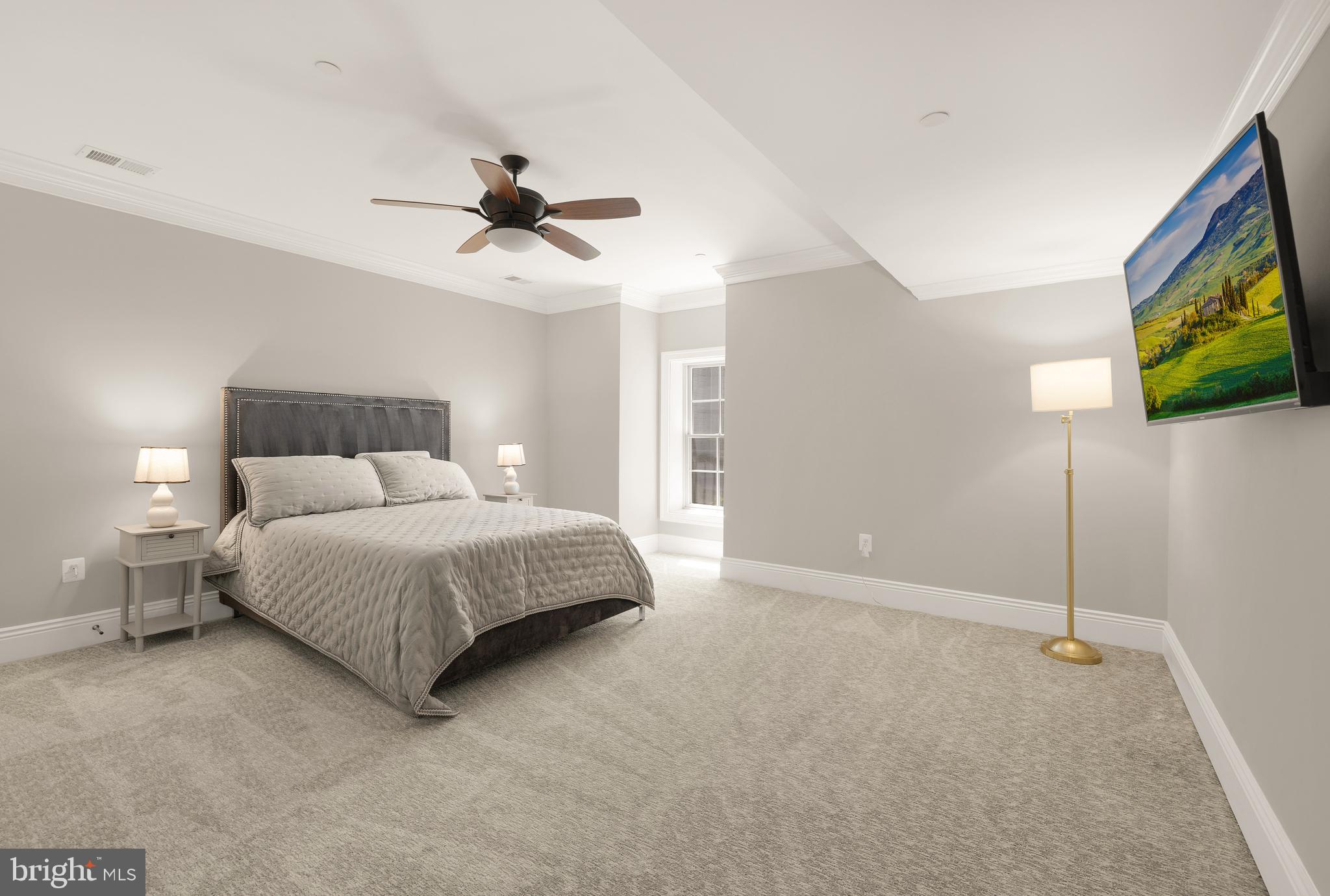 5606 Parkston Road Bethesda, MD 20816 - Photo 46 of 50 a bedroom with a bed and a flat screen tv