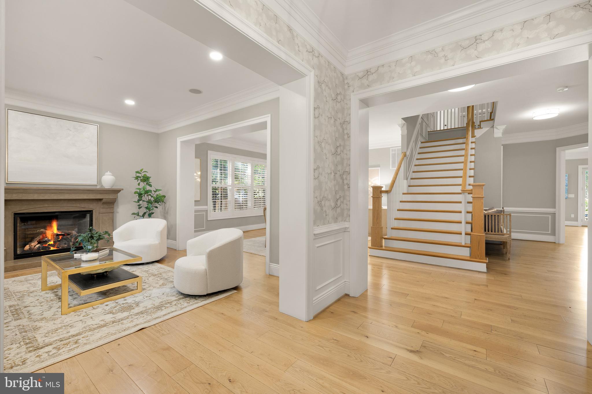 5606 Parkston Road Bethesda, MD 20816 - Photo 7 of 50 a living room with furniture and a fireplace