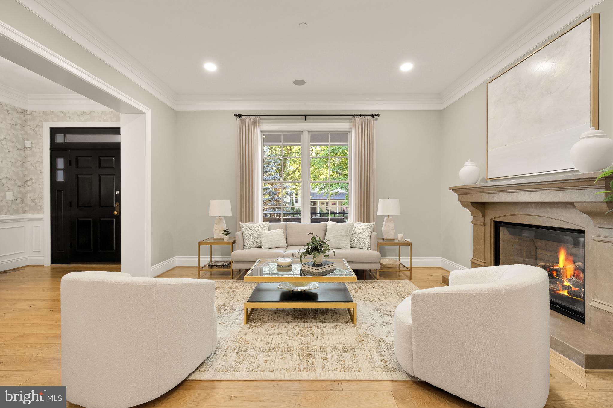 5606 Parkston Road Bethesda, MD 20816 - Photo 10 of 50 a living room with furniture and a fireplace