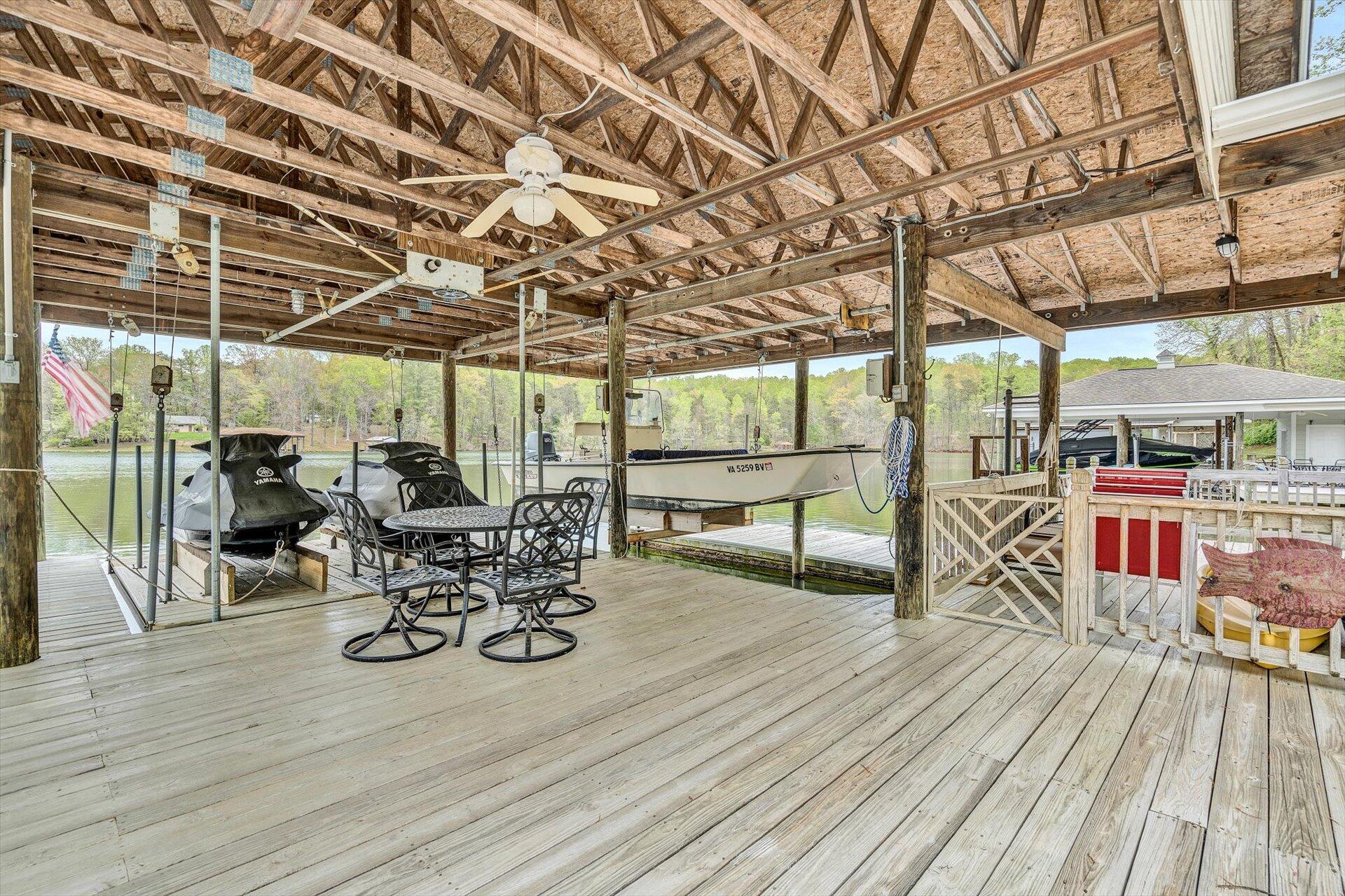515 Cedar Ridge Road Union Hall, VA 24176 - Photo 46 of 51 a view of a patio with table and chairs and wooden floor