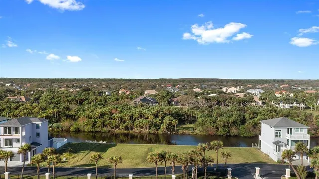 an aerial view of a house with a lake view