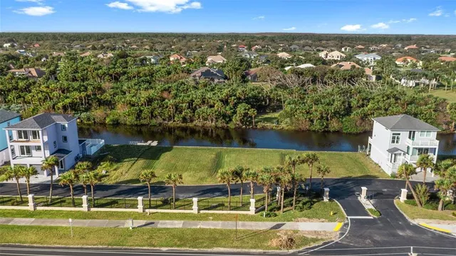 an aerial view of a house with a swimming pool outdoor seating and yard