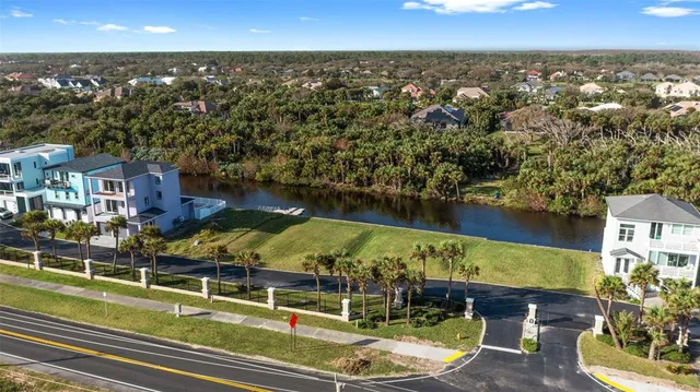 an aerial view of a house with a swimming pool