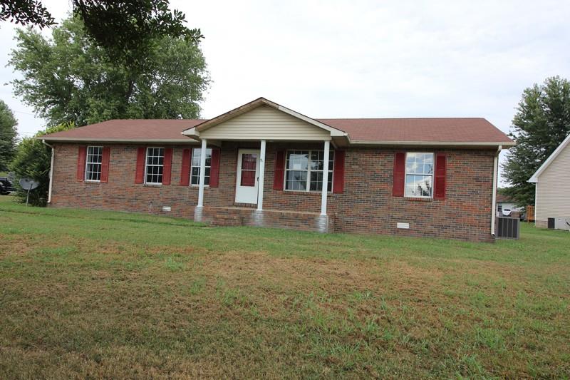 488 Hugh Hunter Road Oak Grove, KY 42262 - Photo 1 of 10 a front view of a house with garden
