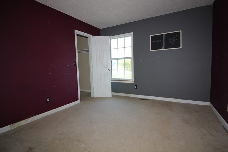 488 Hugh Hunter Road Oak Grove, KY 42262 - Photo 8 of 10 an empty room with windows