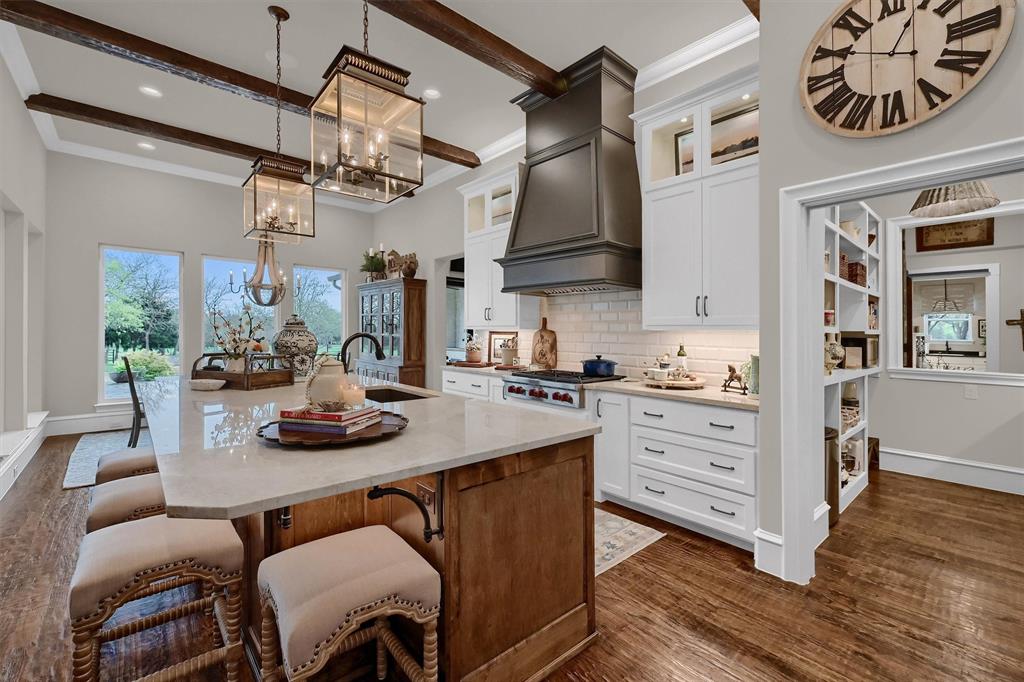 8301 Stephens Ranch Road Pilot Point, TX 76258 - Photo 12 of 40 a kitchen with stainless steel appliances granite countertop a sink and cabinets