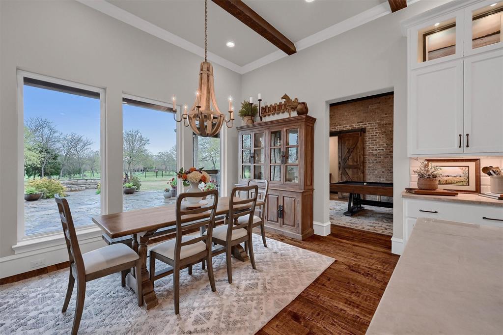 8301 Stephens Ranch Road Pilot Point, TX 76258 - Photo 16 of 40 a dining room with furniture and window